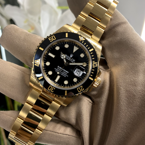 Rolex Submariner gold and black