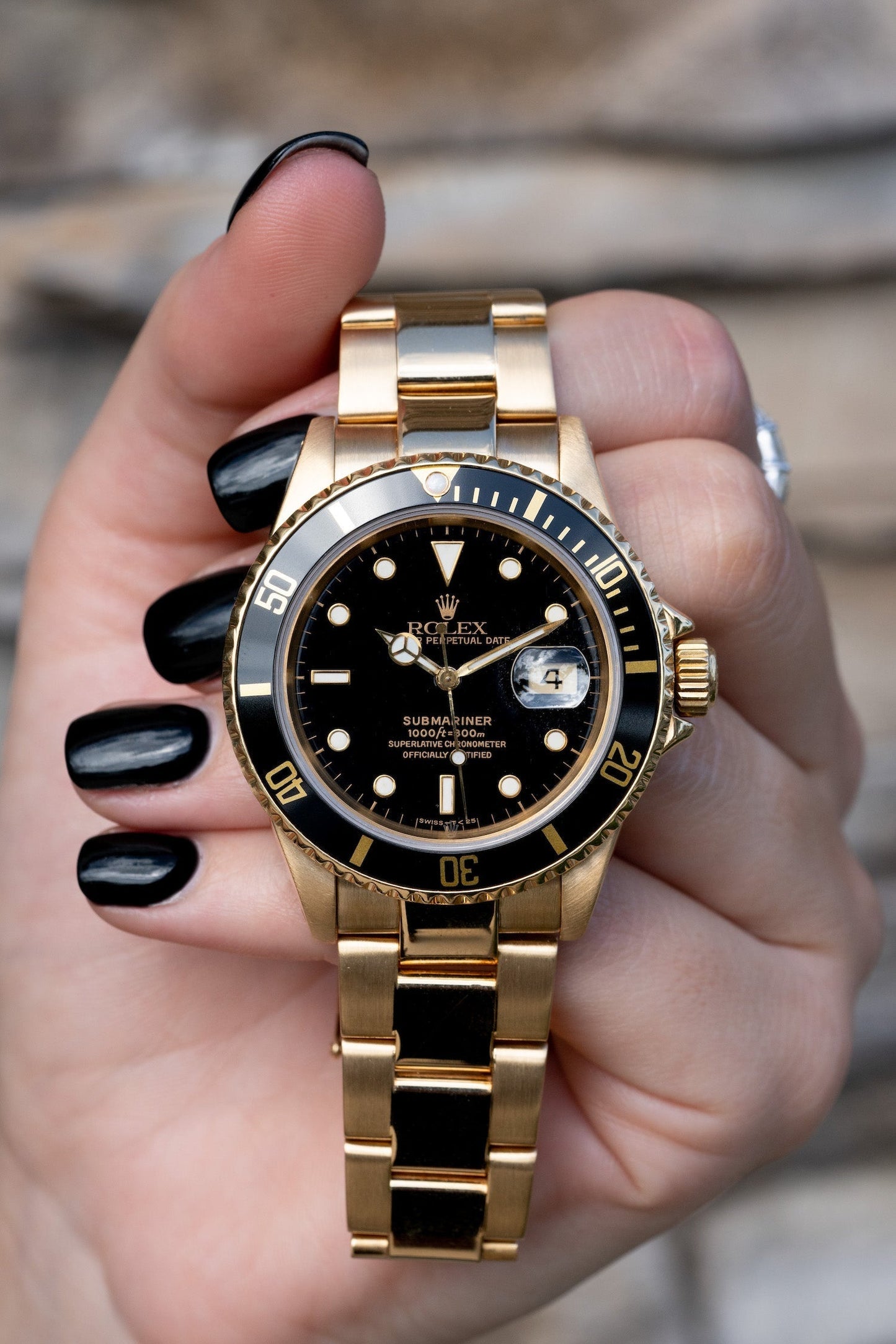 Rolex Submariner gold and black
